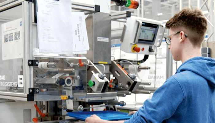 Utz trainee learning how to operate machinery