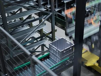 Utz containers transported on conveyor system at GZ Media's warehouse