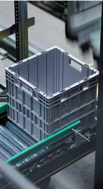 Utz container transported on a conveyor system in an automated warehouse