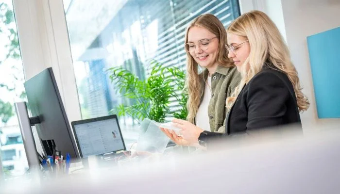 Two ladies working at Utz office